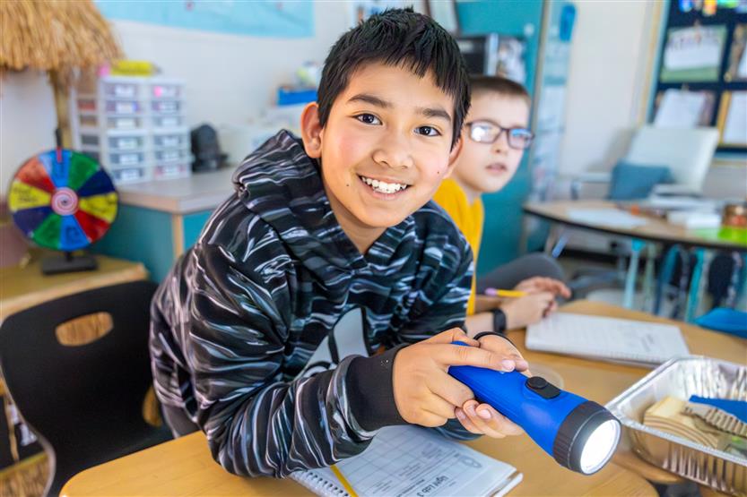 Elementary students doing a light lab